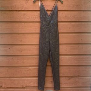 Black jumper with a print, open back.